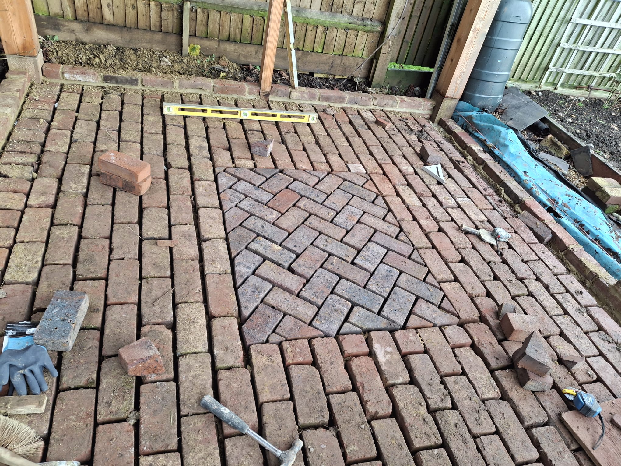 Hand-laid herringbone brick pathway
