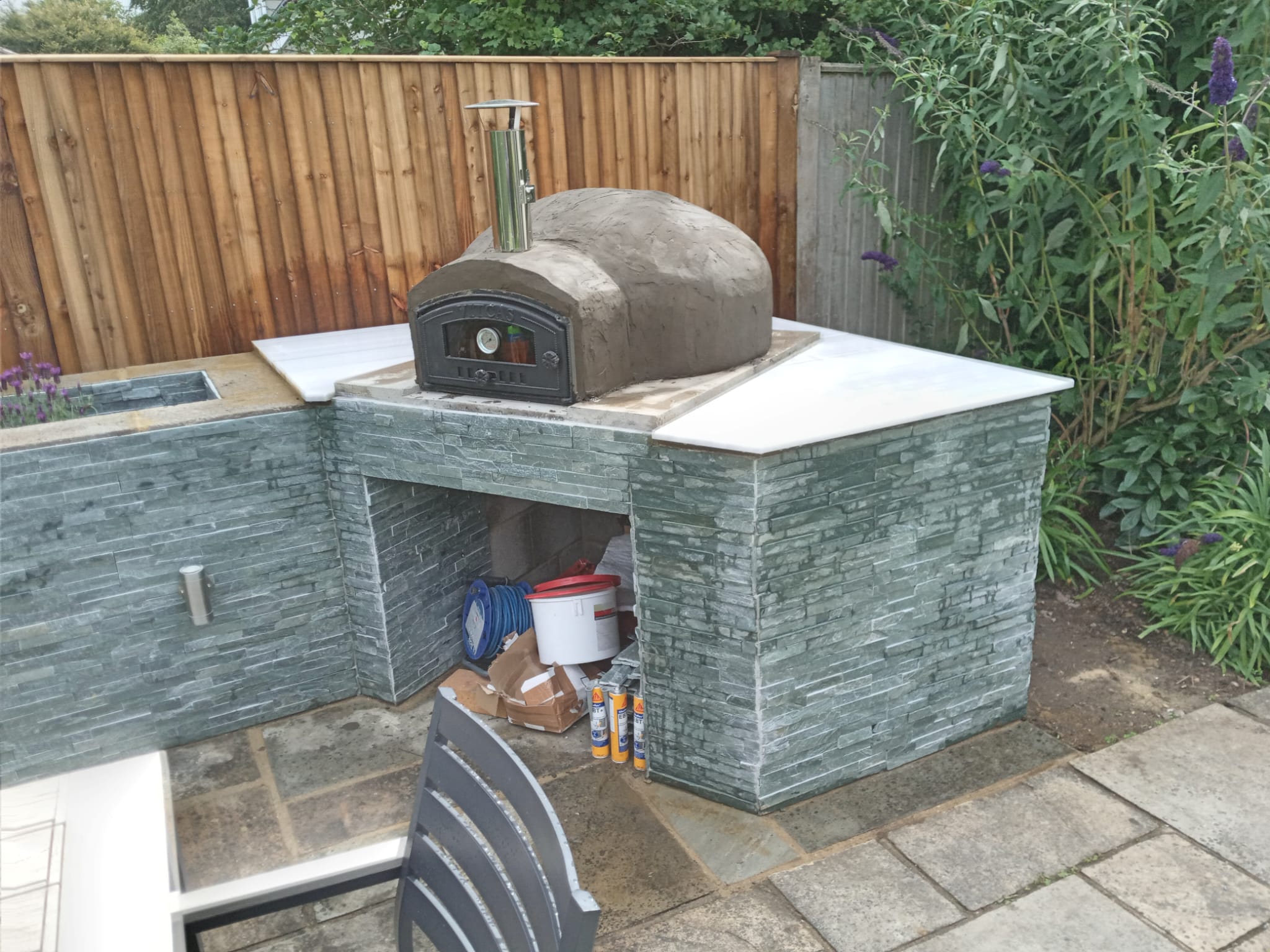 Outdoor stone and slate pizza oven kitchen