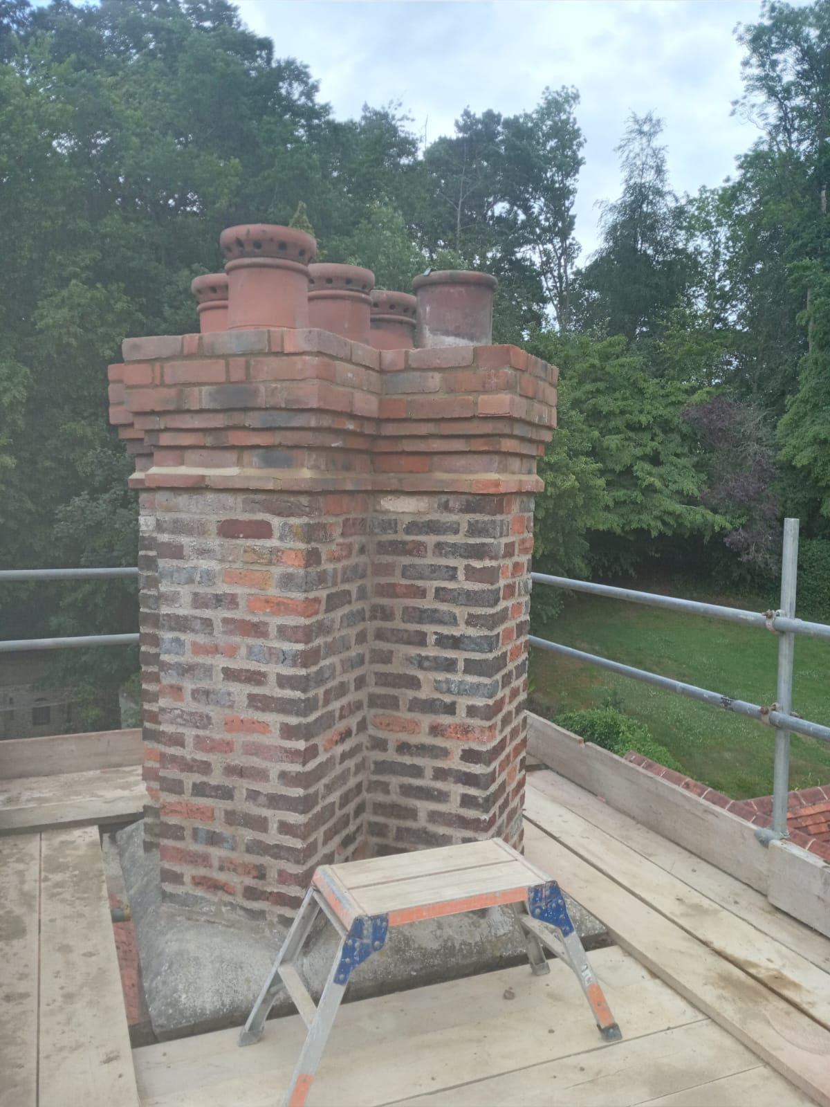 Chimney stack rebuild on scaffolding boards